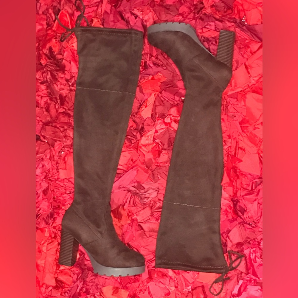 Thigh high adjustable brown boots with chunky heel and platform comfort.